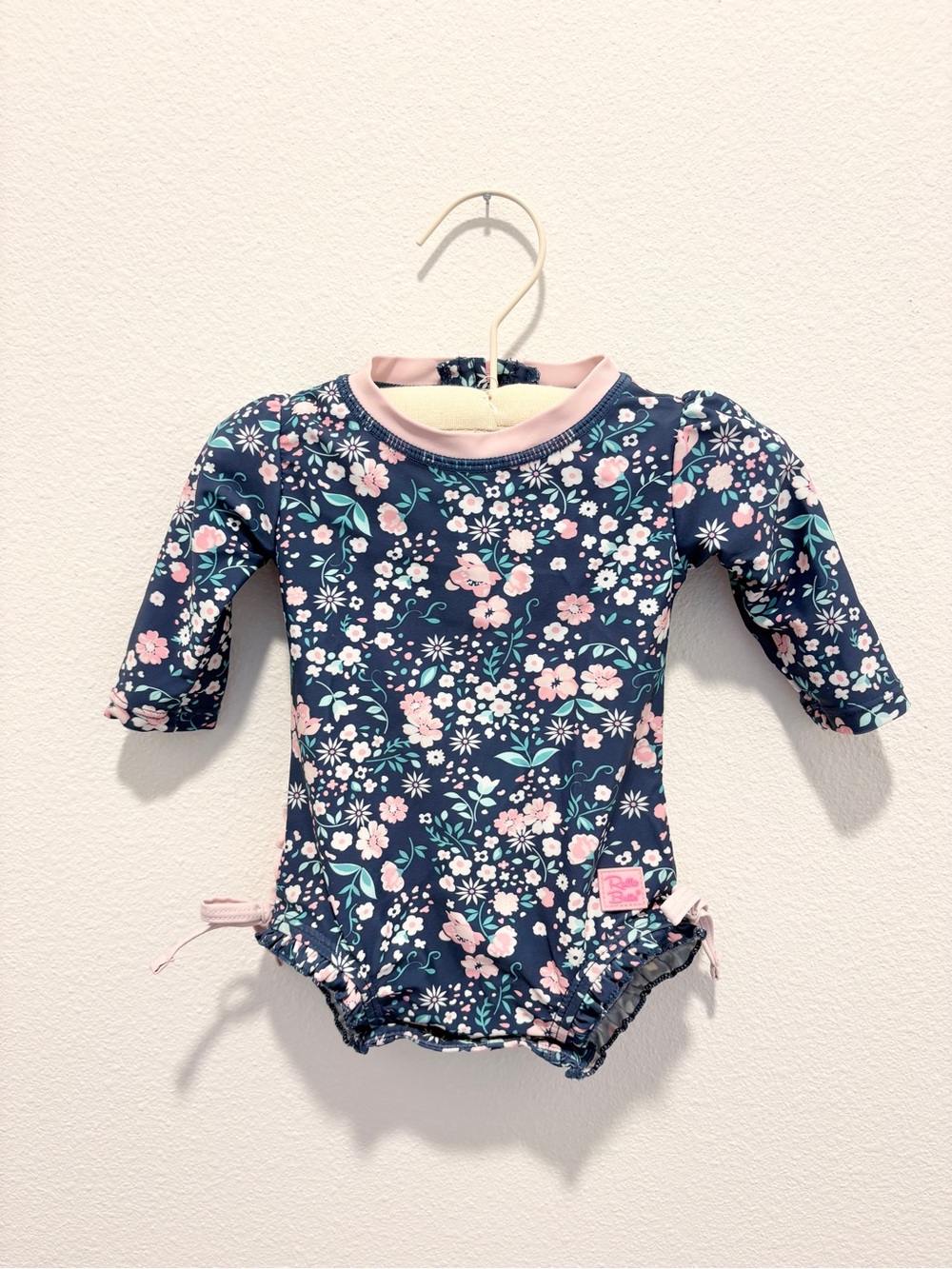 Ruffle Butts Navy Floral Infant Swimsuit with Pink Trim